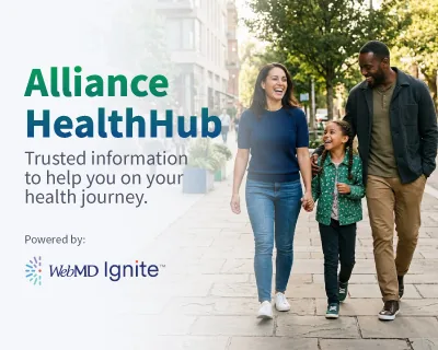 A smiling woman and young girl making a heart shape with their hands, standing outdoors with sunlight filtering through the trees. The text reads 'Manage Your Health Toolkit.'
