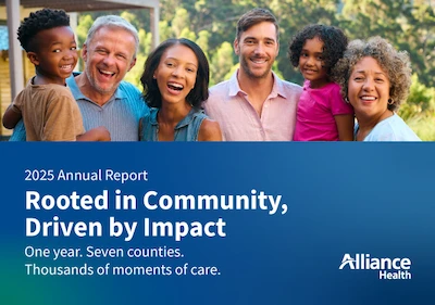 A spread of the Alliance Health Annual Report documents showcasing graphs, photos of people, and text highlights.